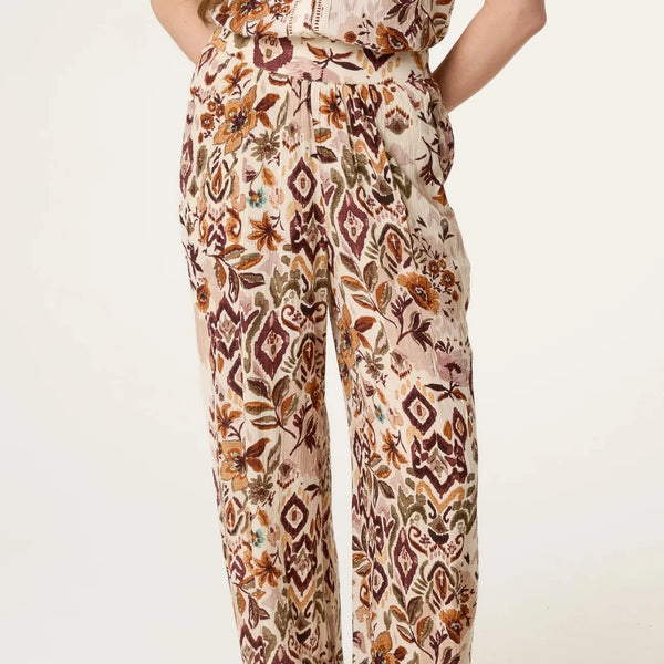 ABSTRACT FLORAL TROUSERS IN TAUPE