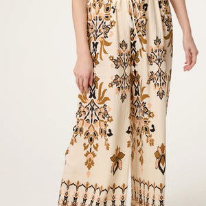 BORDER PRINT SAND WIDE LEG TROUSERS