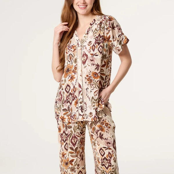 BUTTON FRONT FLORAL TOP IN TAUPE